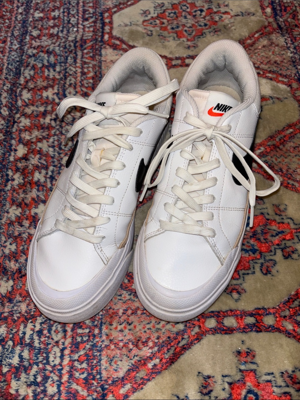 Nike Women's White Sneakers with Black Swoosh and Tan Trim